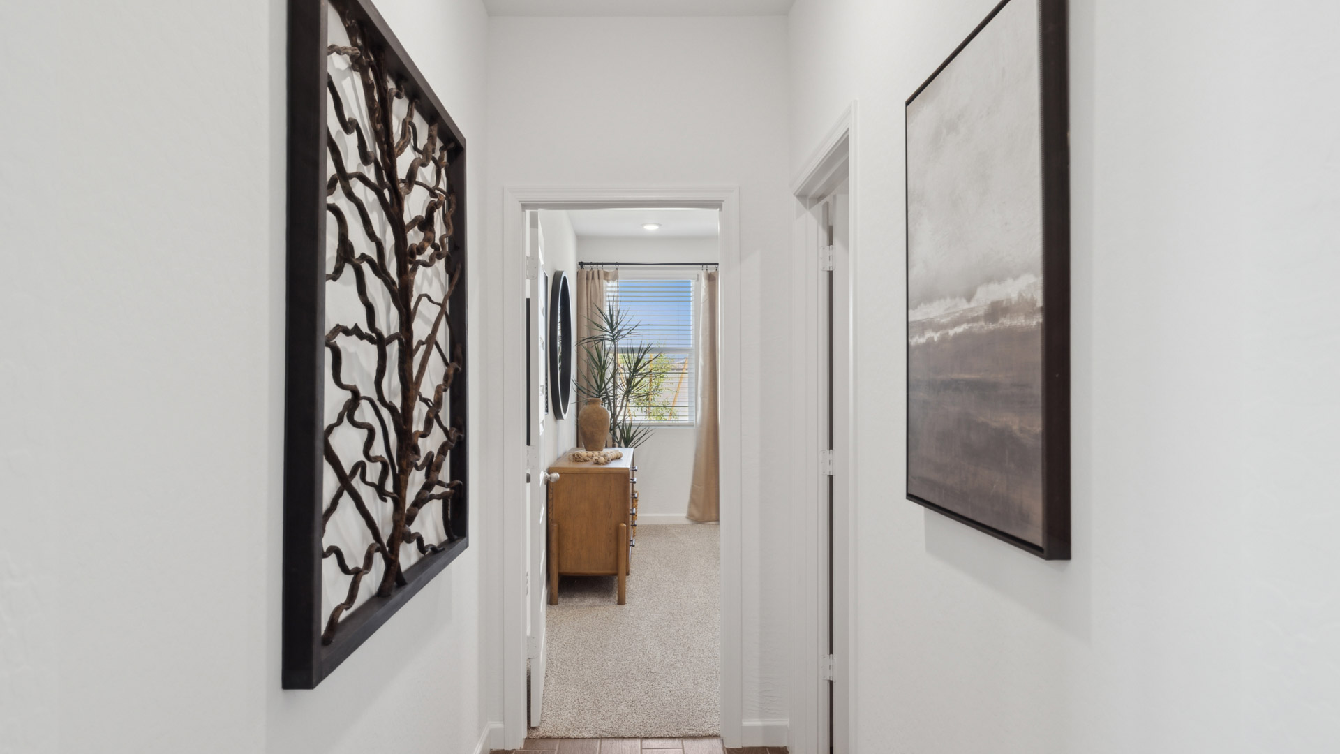 Hallway leading to primary bedroom.