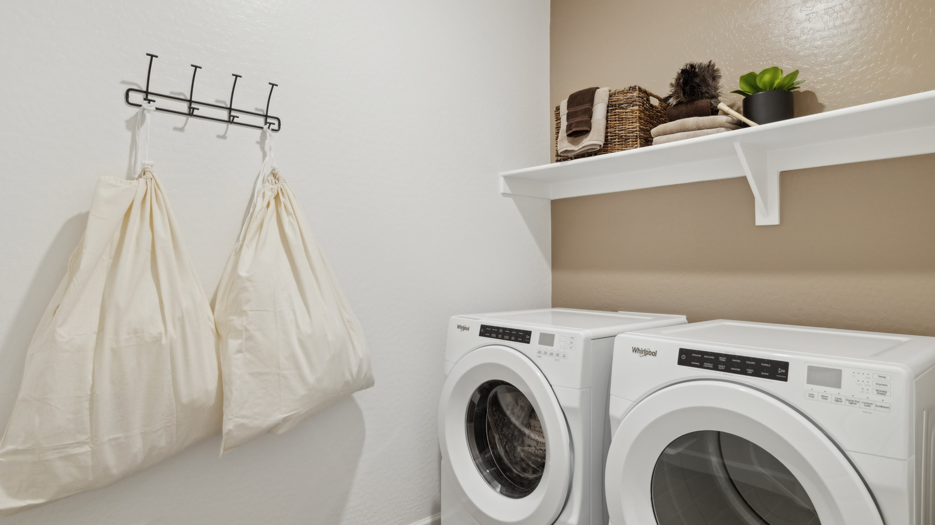 Laundry room with shelving.