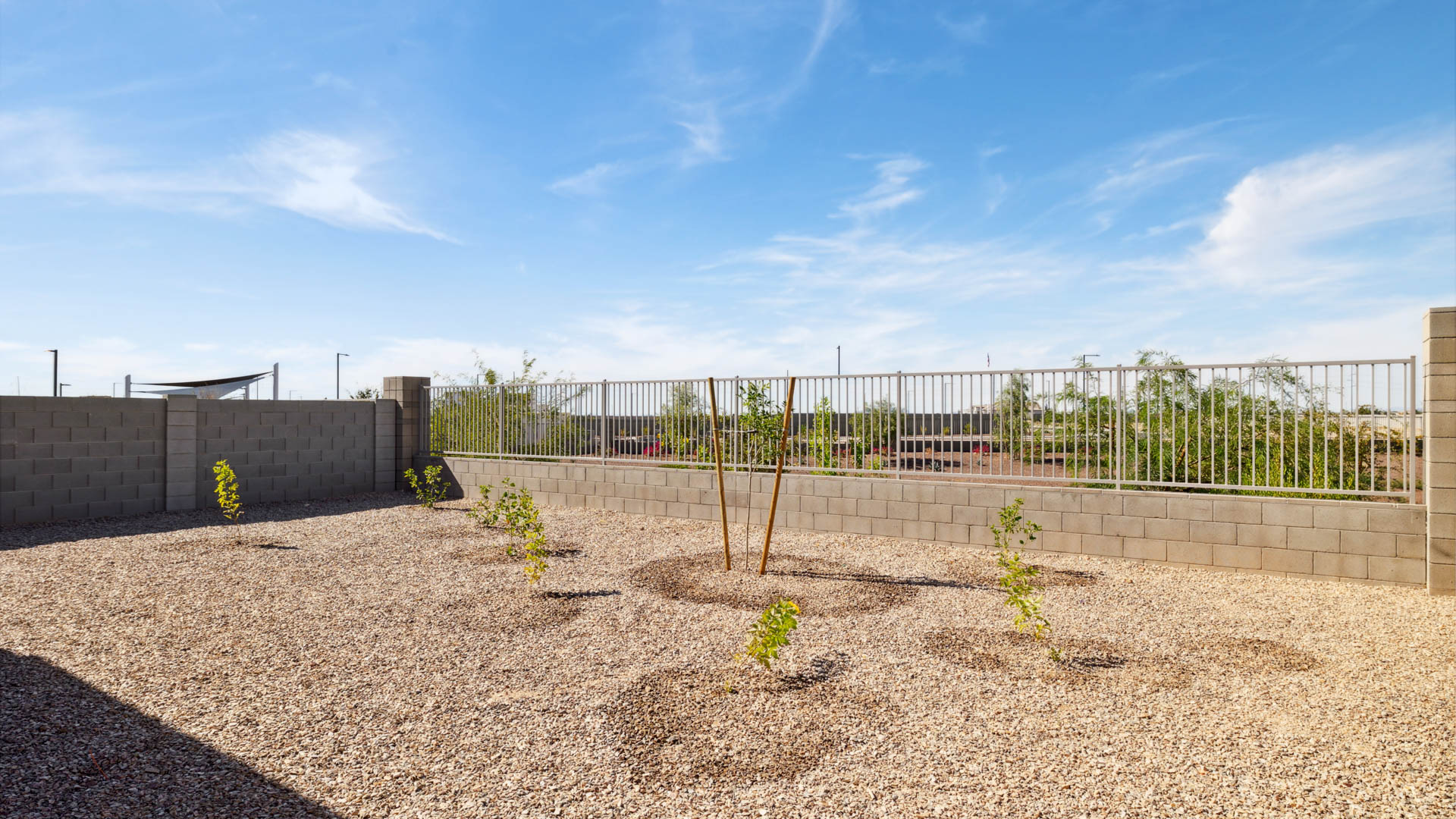 Large fenced-in backyard with a covered patio, perfect for outdoor entertaining.