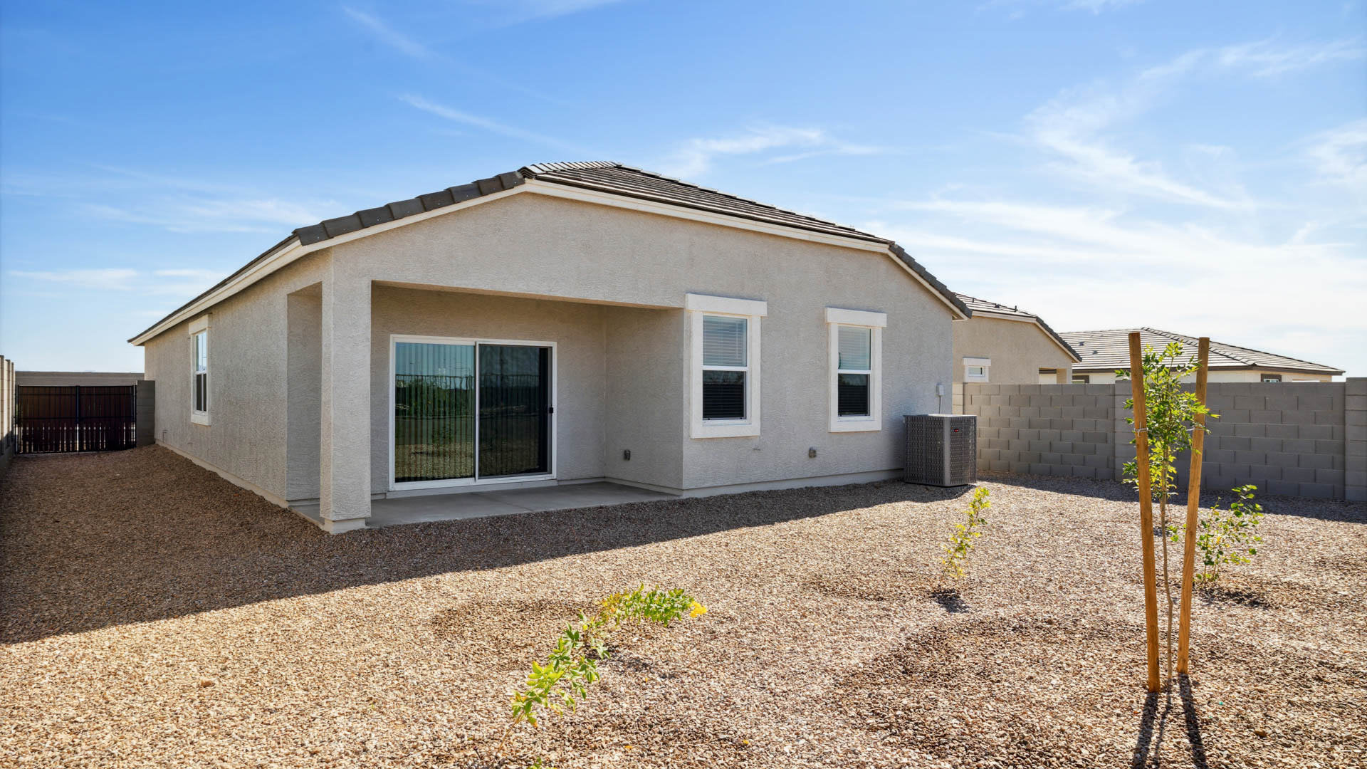 Large fenced-in backyard with a covered patio, perfect for outdoor entertaining.