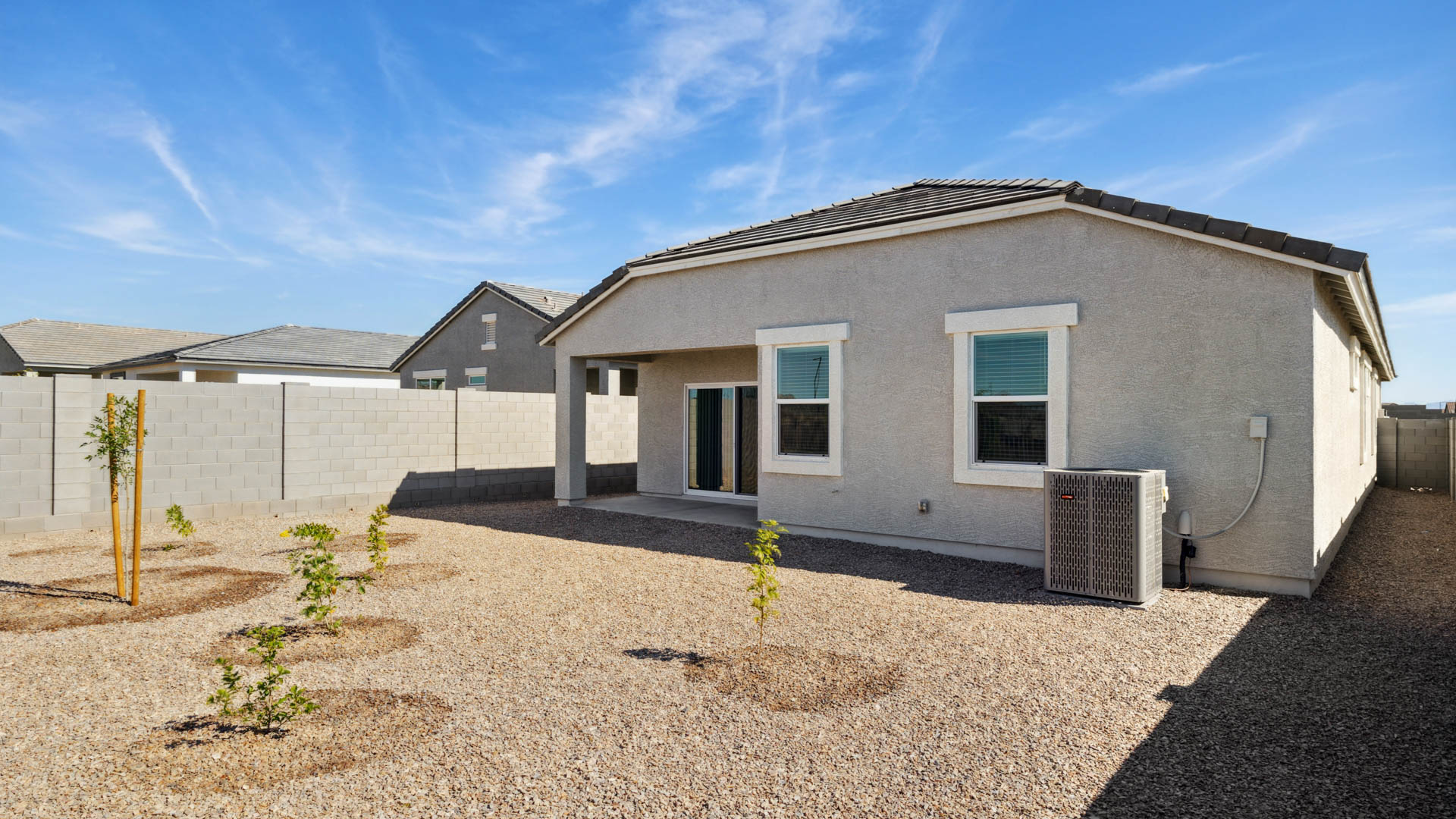Large fenced-in backyard with a covered patio, perfect for outdoor entertaining.