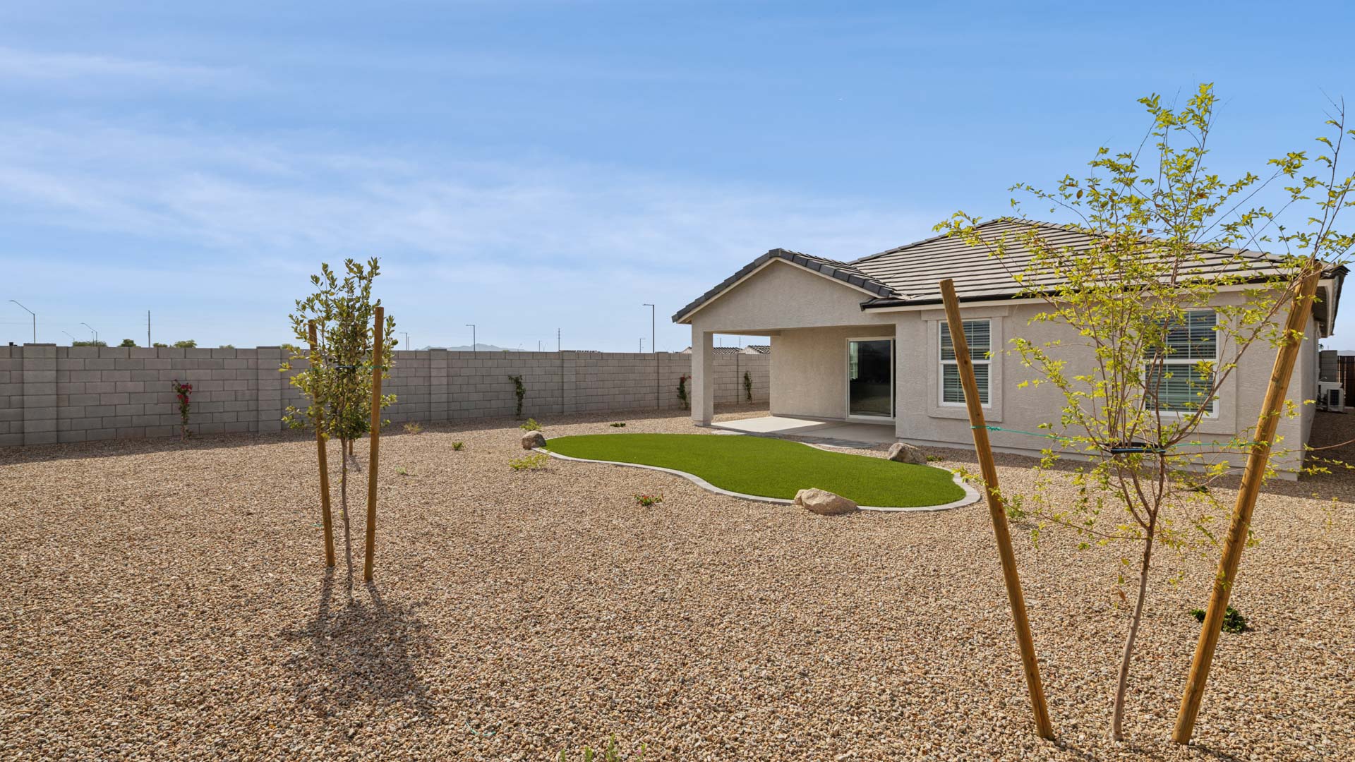 back of home with covered patio