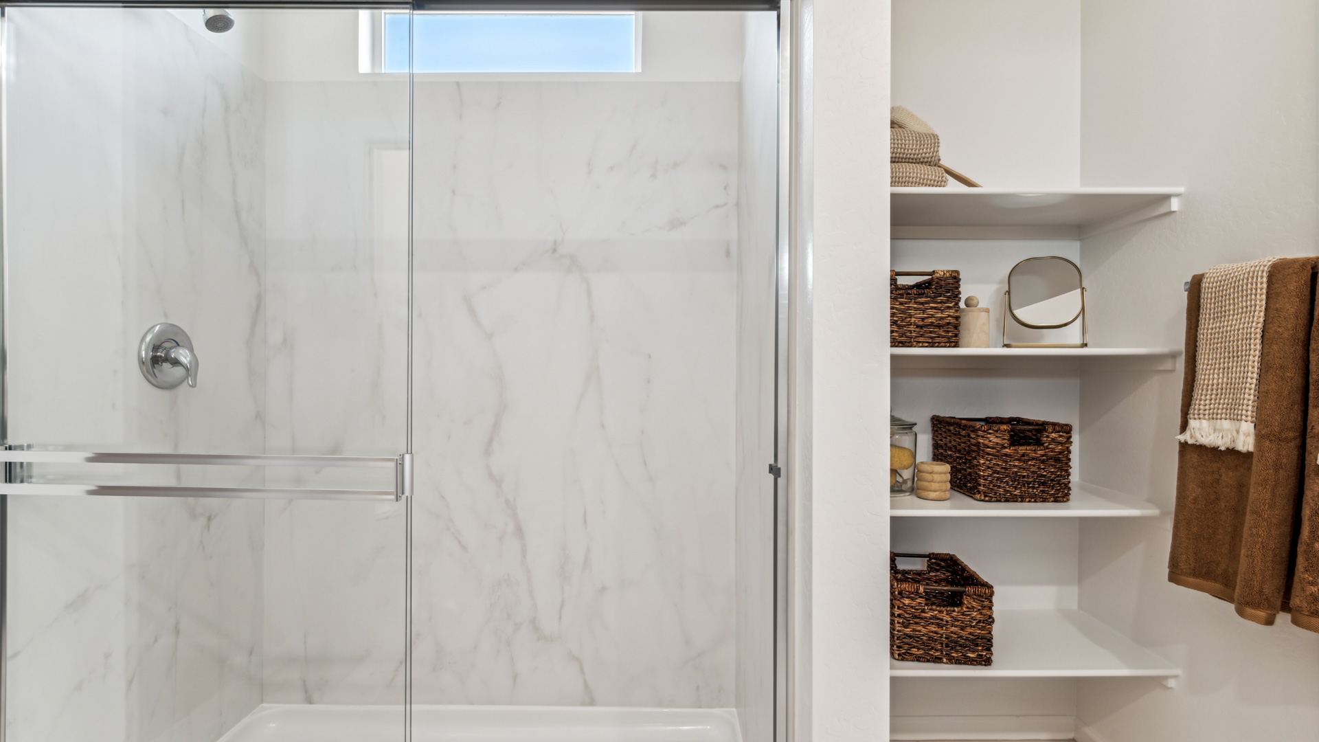 Comfortable guest bedroom featuring neutral-toned walls and a large closet.