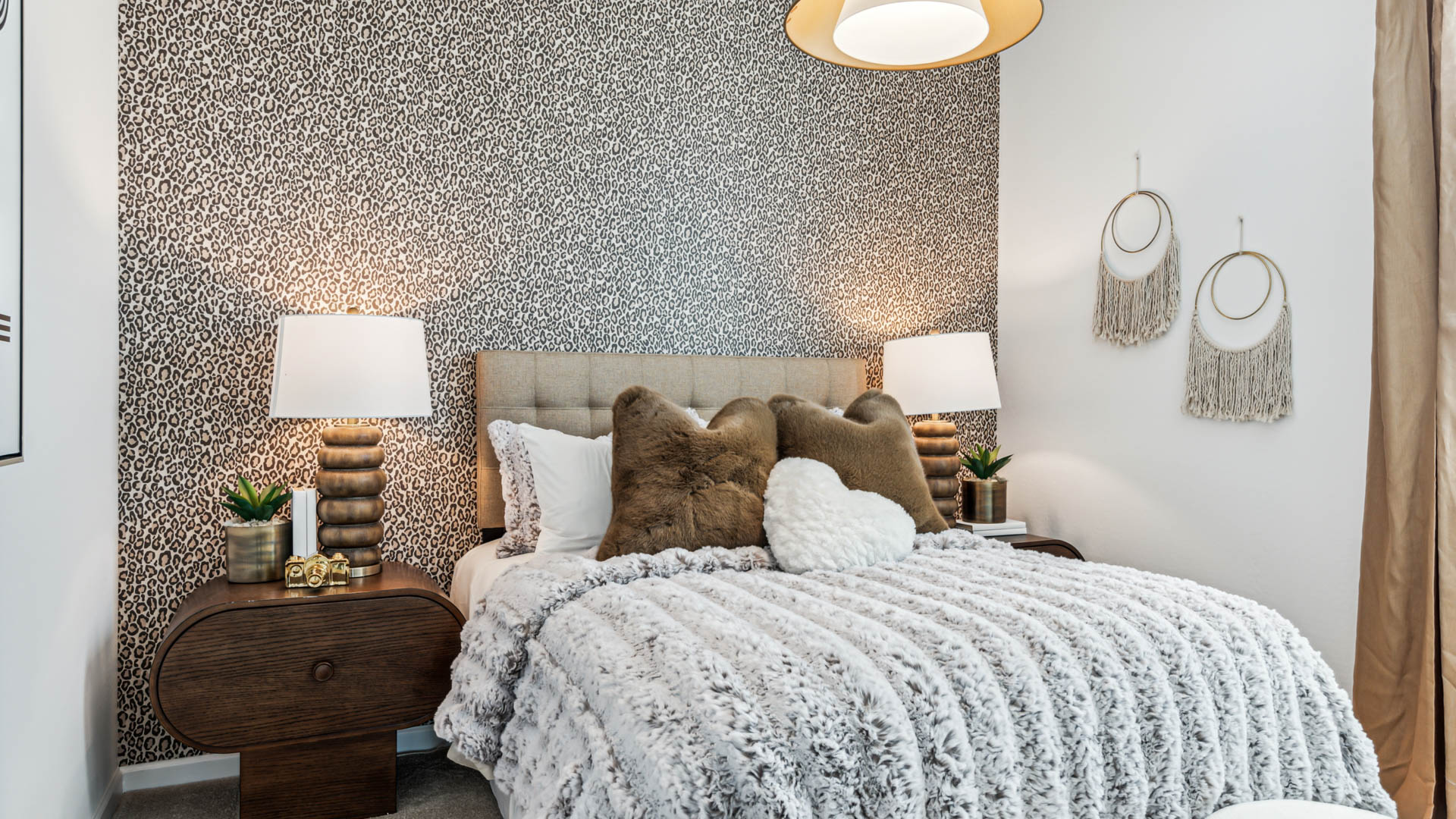 Comfortable guest bedroom featuring neutral-toned walls and a large closet.
