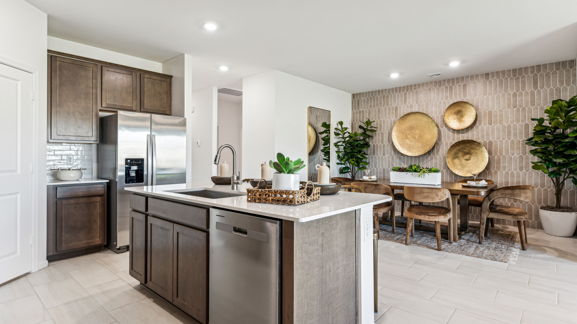 Spacious kitchen with island and stainless-steel appliances.