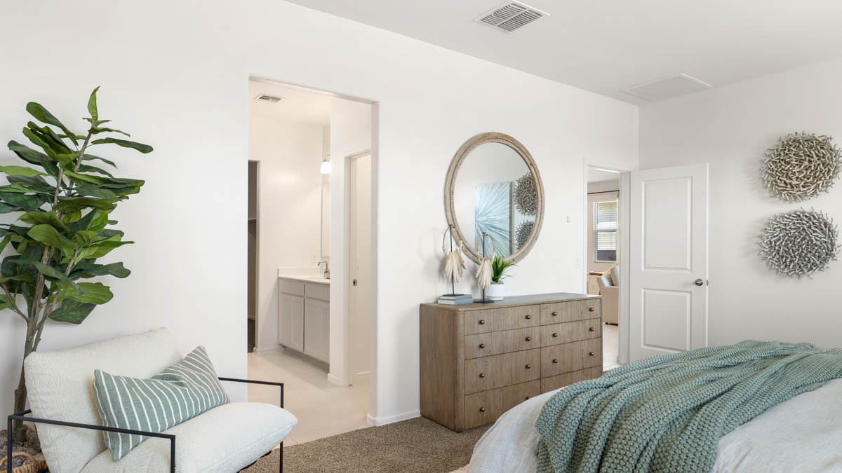 Primary bedroom with a walk-in closet.