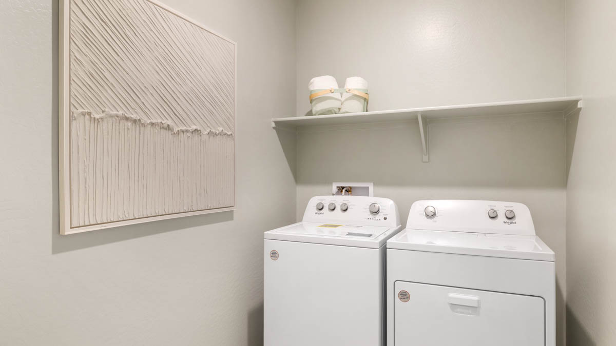 Laundry room with shelving.