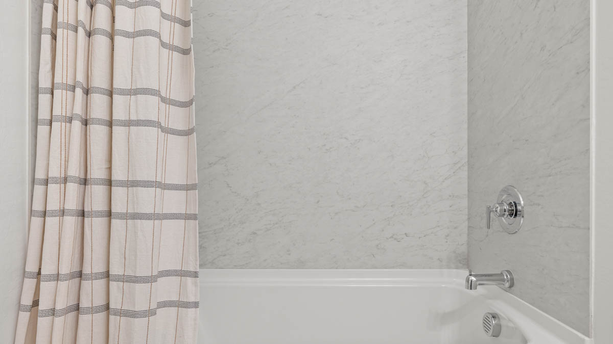 Second bathroom with a bathtub.