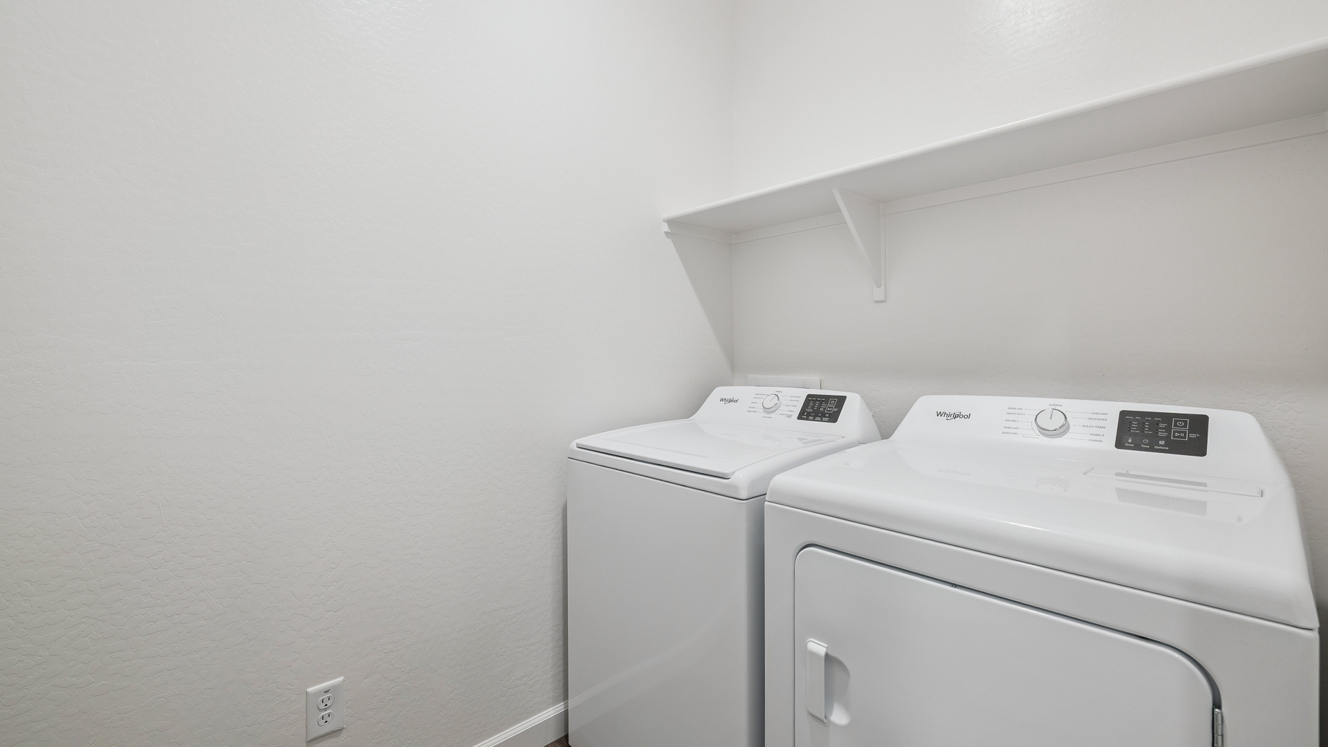 laundry room with shelving