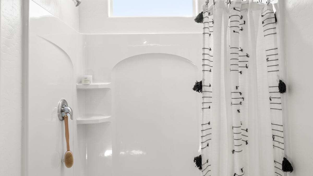 primary bathroom with dual vanities