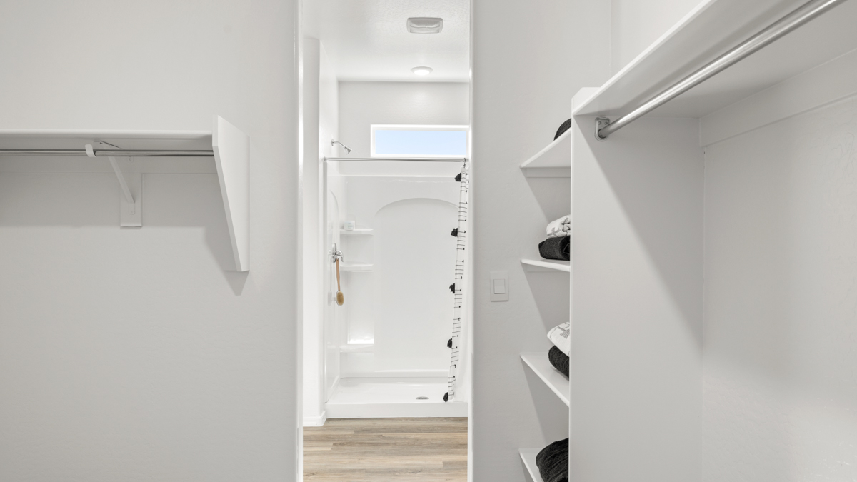 primary bathroom with dual vanities