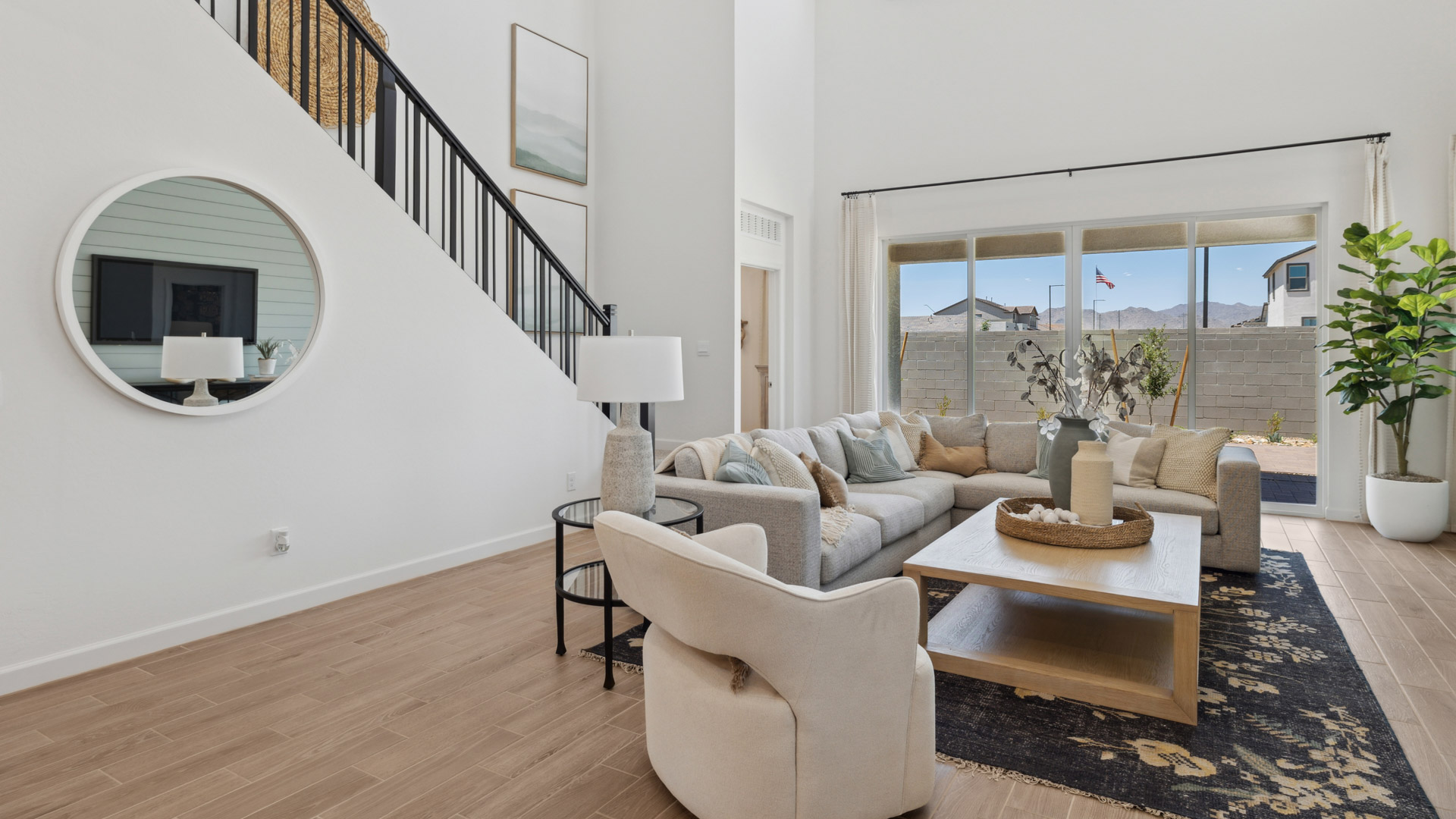 A cozy living room featuring a comfortable couch, a stylish coffee table, and an elegant painting on the wall.