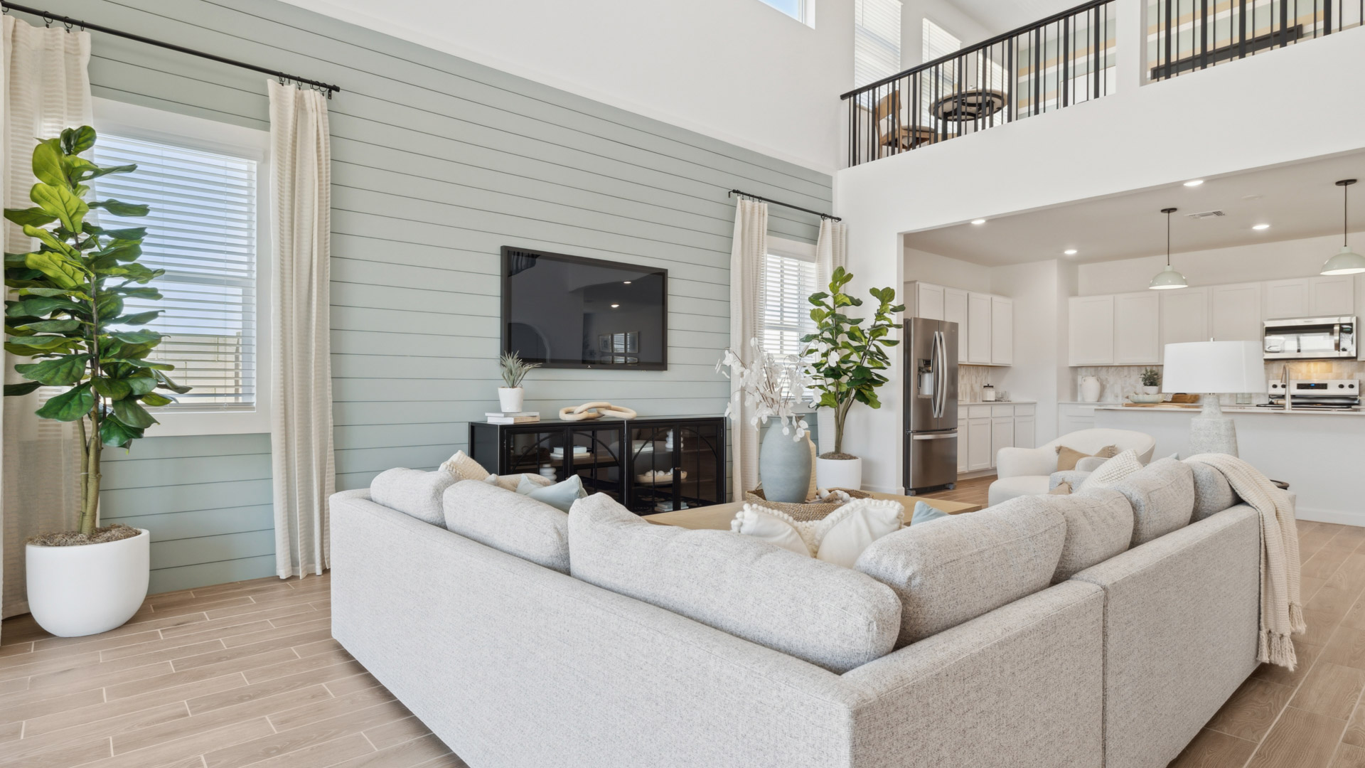 A cozy living room featuring a comfortable couch, a stylish coffee table, and an elegant painting on the wall.