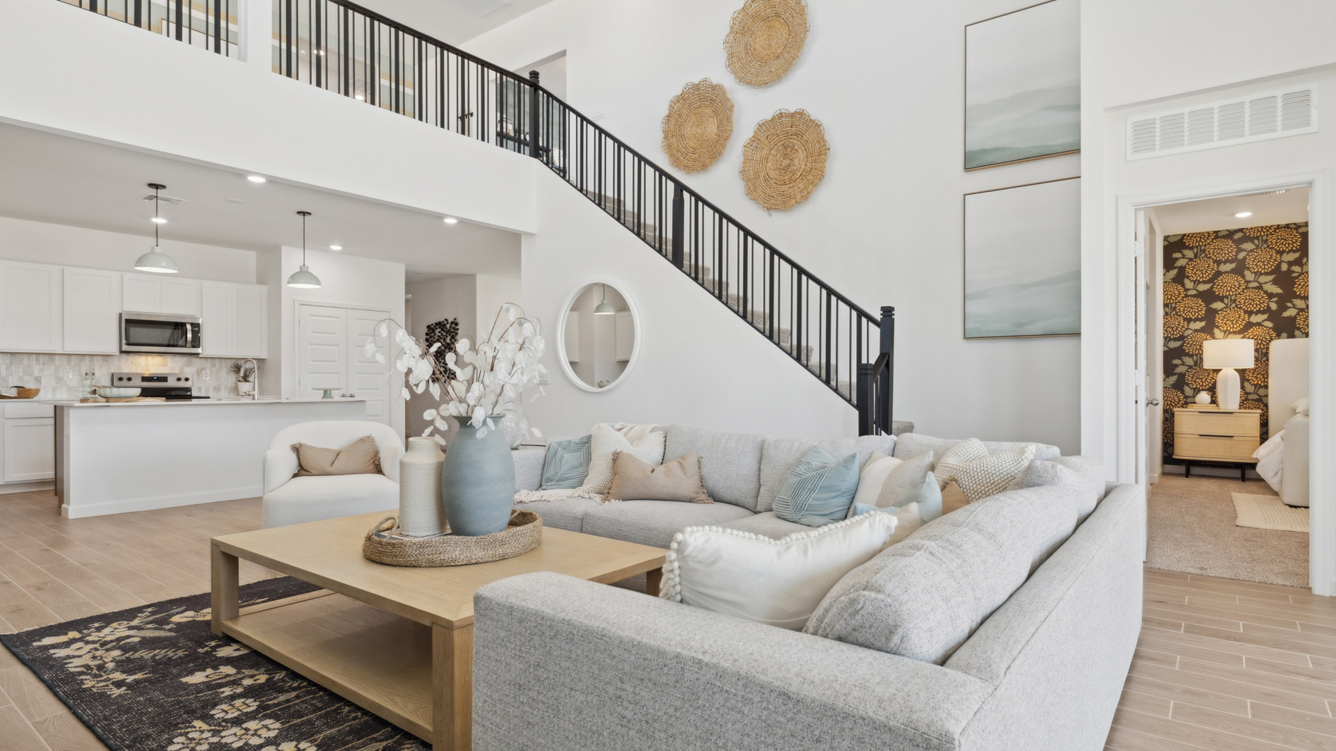 A cozy living room featuring a comfortable couch, a stylish coffee table, and an elegant painting on the wall.