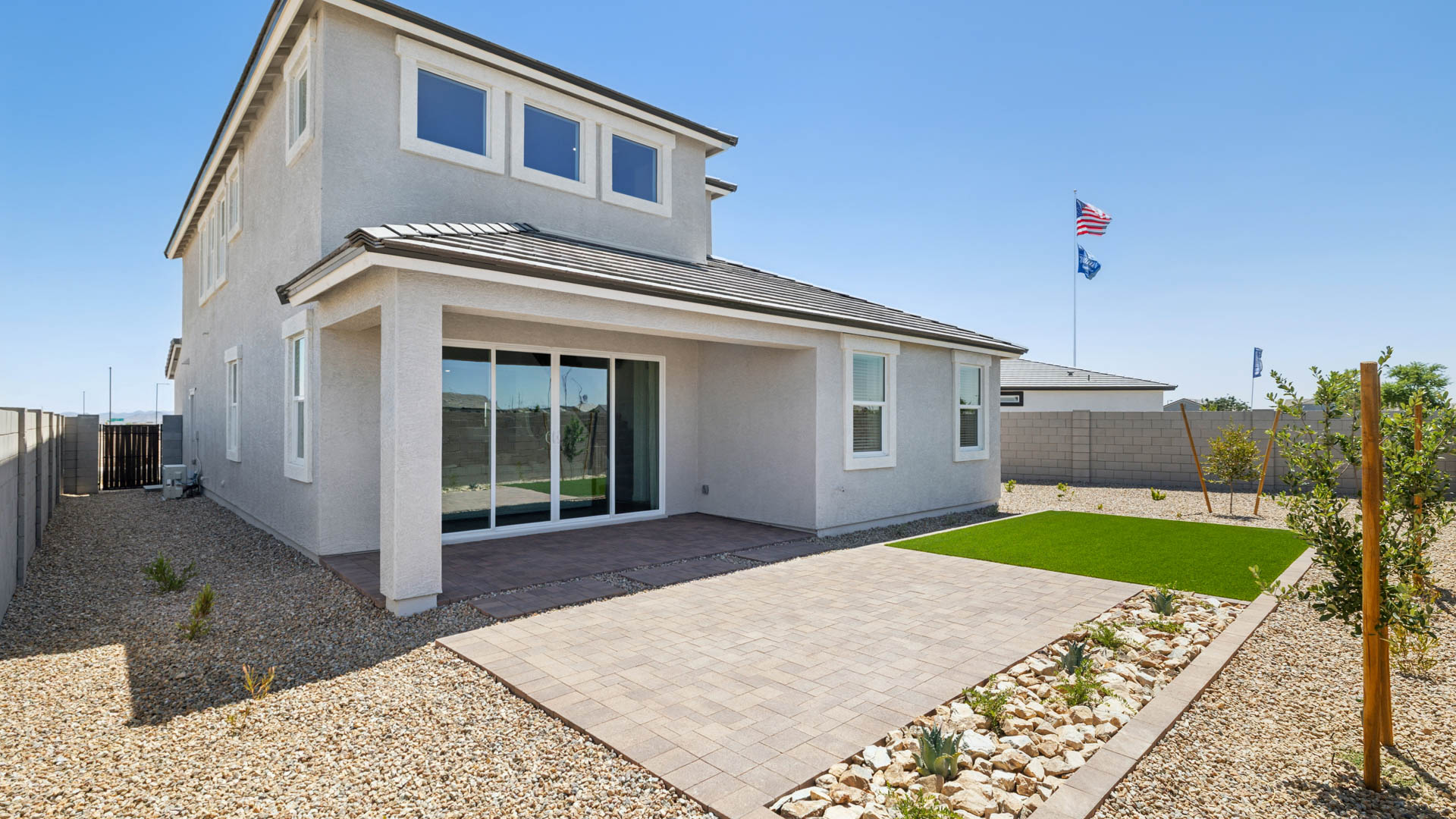 Large fenced-in backyard with a covered patio, perfect for outdoor entertaining.