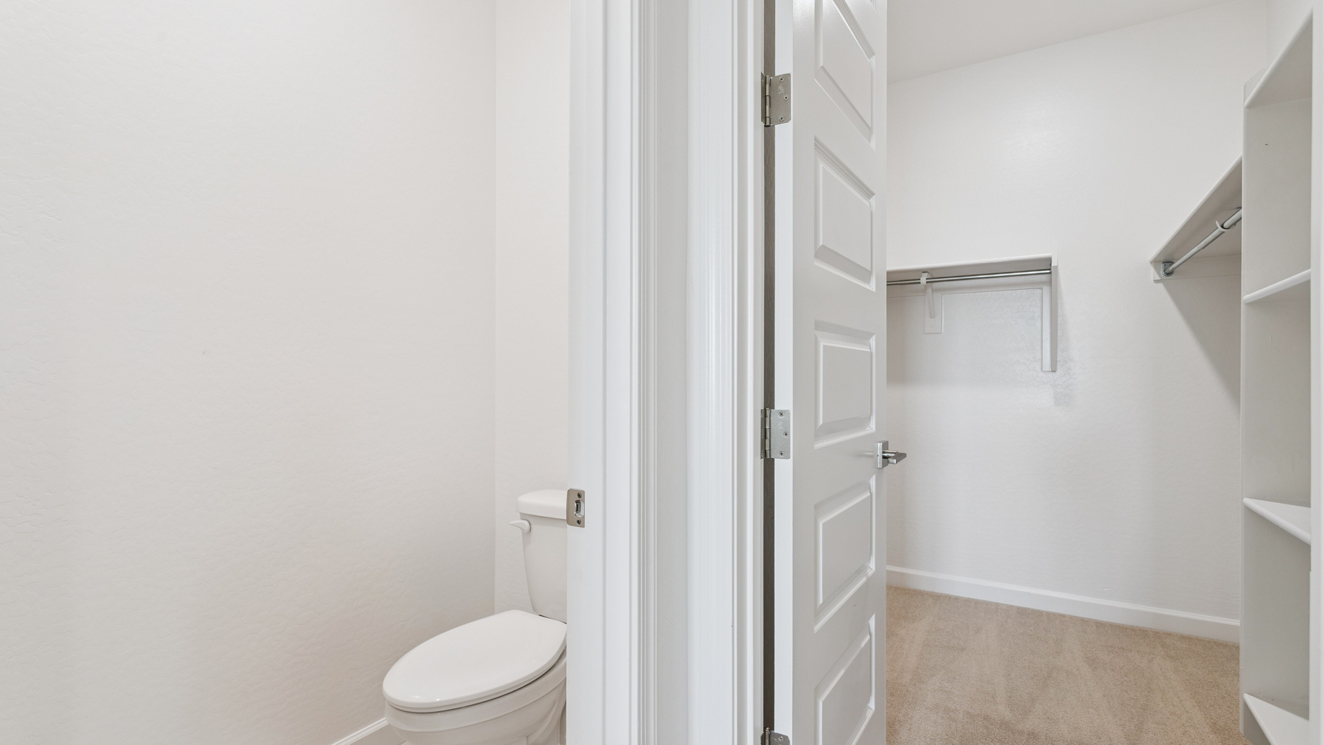 primary bathroom with dual vanities