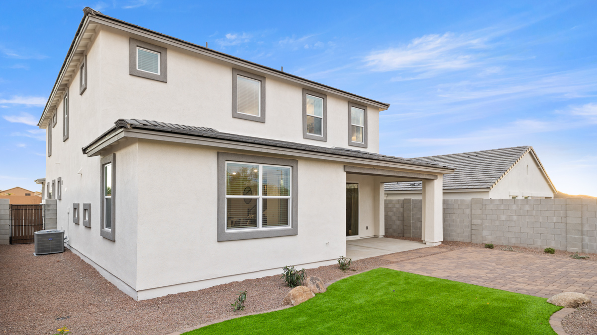 Large fenced-in backyard with a covered patio, perfect for outdoor entertaining.