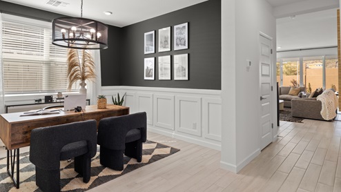 Angled view of office space that looks into the foyer of the home.