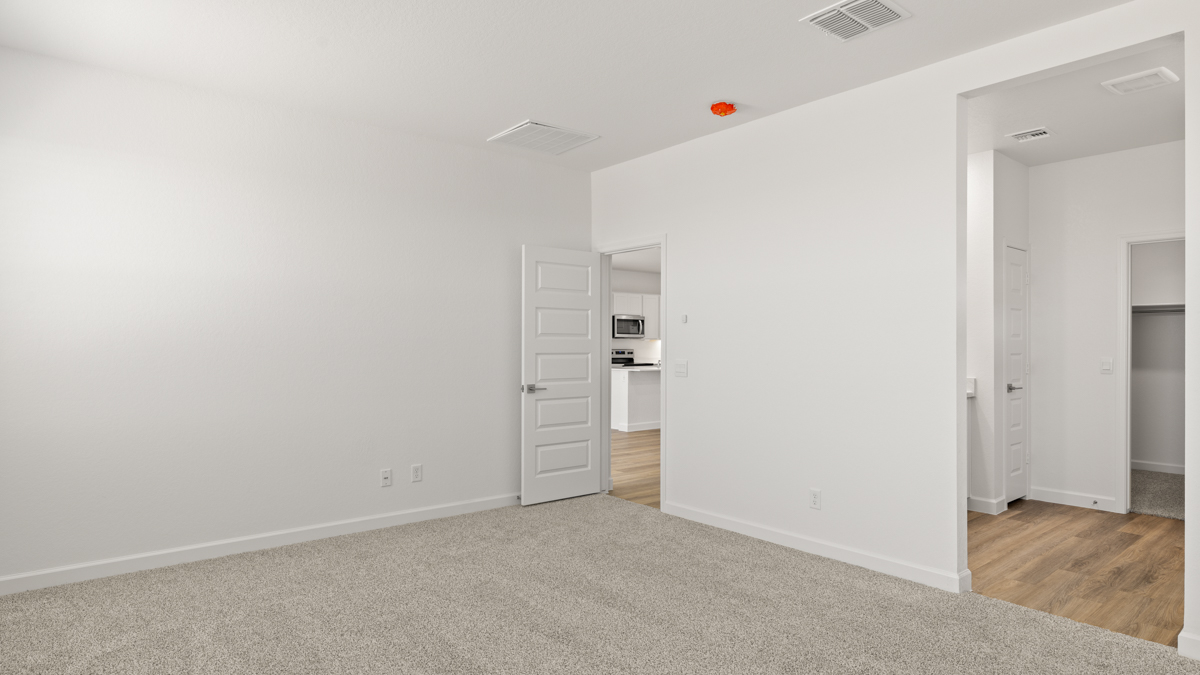Primary suite with walk-in closet.