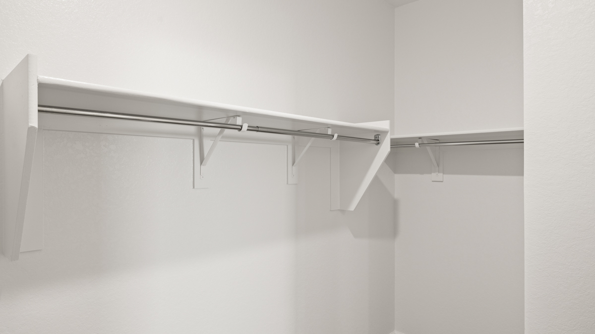 Primary suite with walk-in closet.
