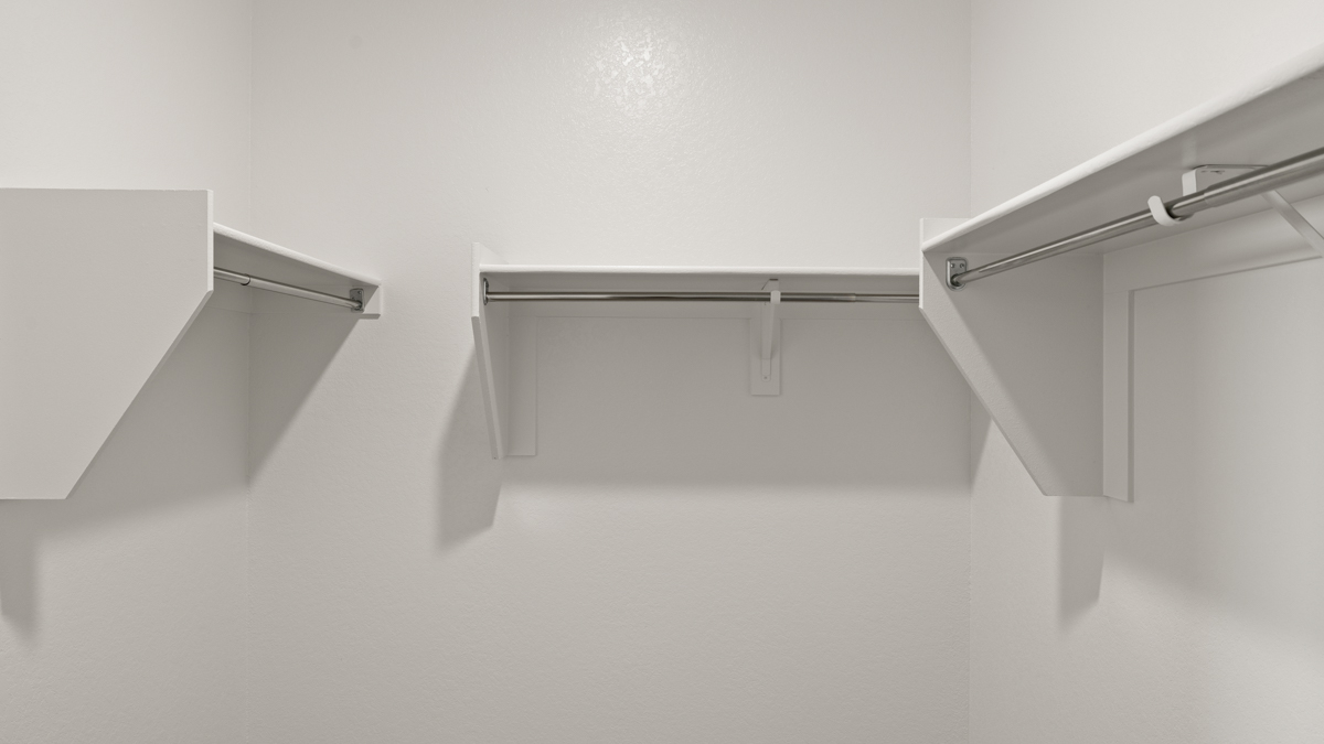 Primary suite with walk-in closet.