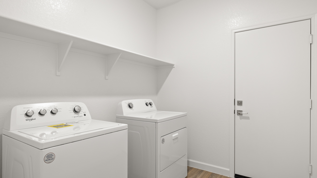 Laundry room with shelving.