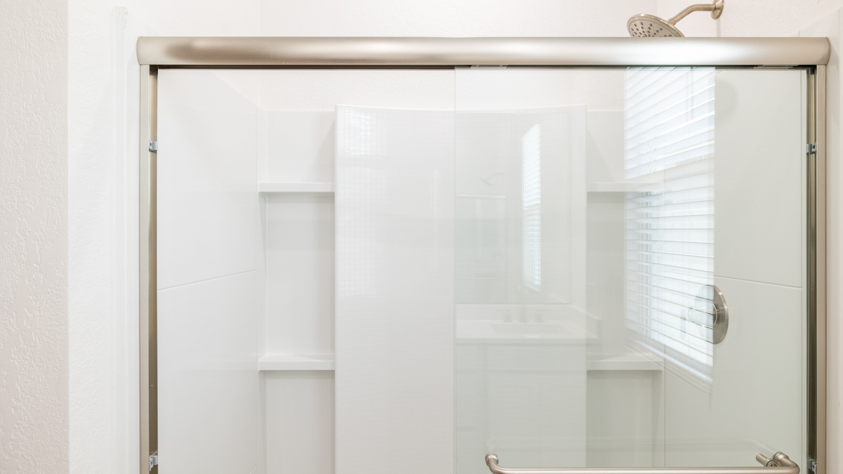 primary bathroom with dual vanities
