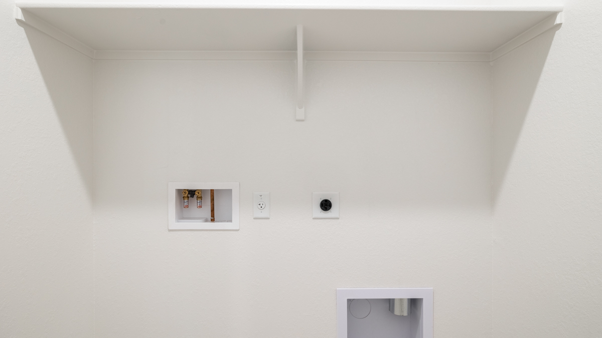 laundry room with shelving