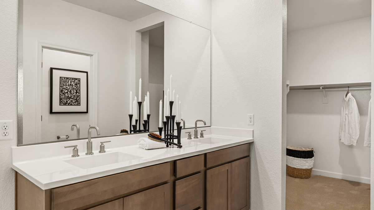 primary suite with dual vanities