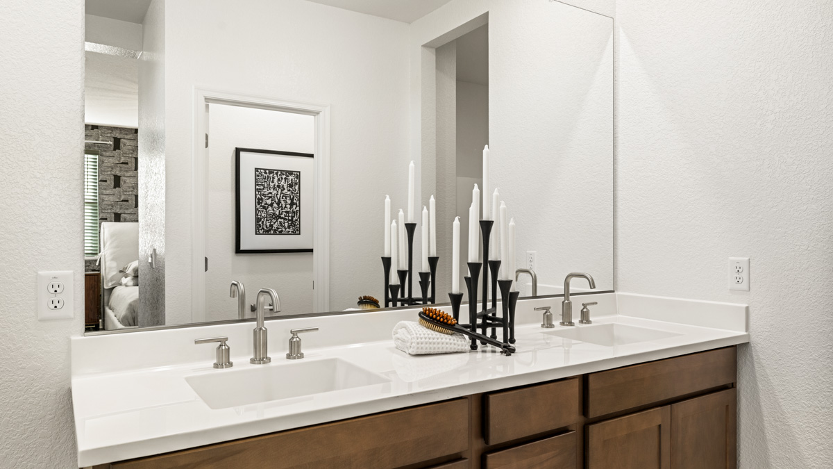primary suite with dual vanities