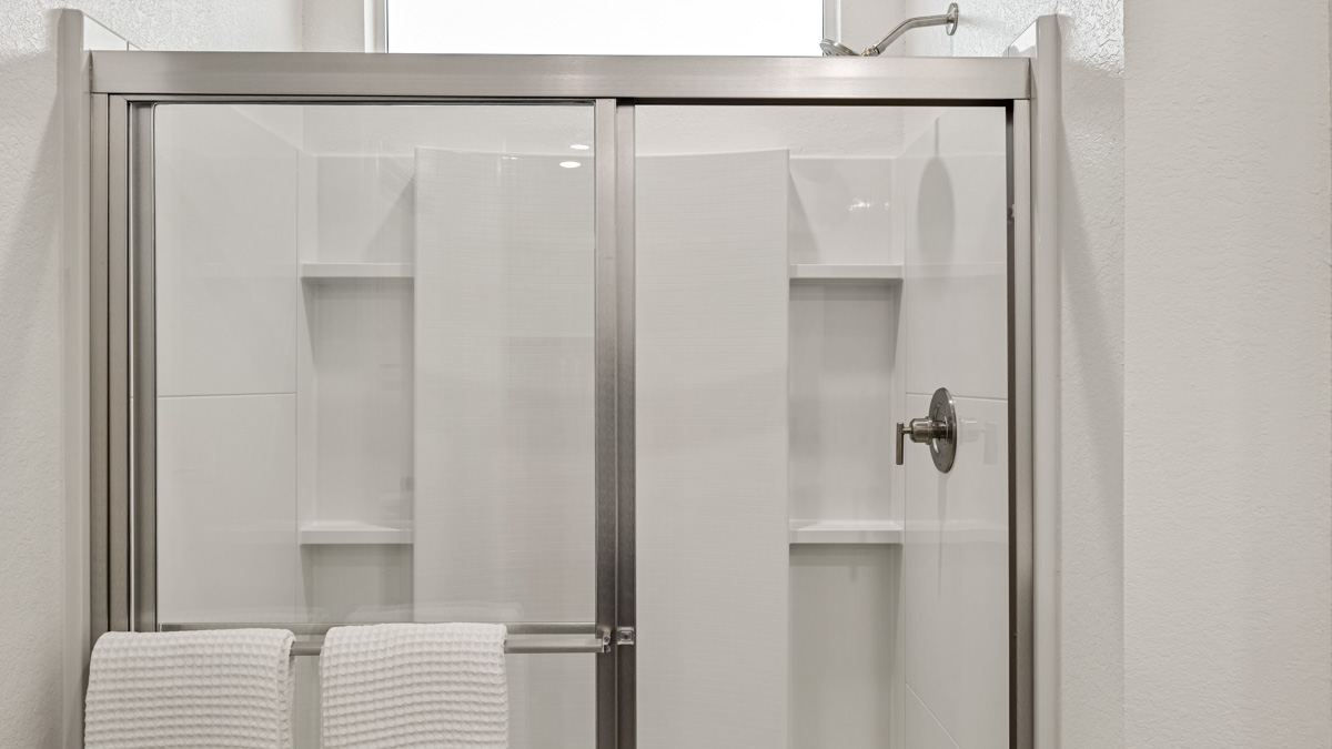 primary suite with dual vanities