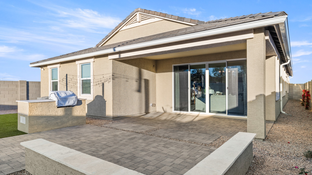 back of new home with covered patio