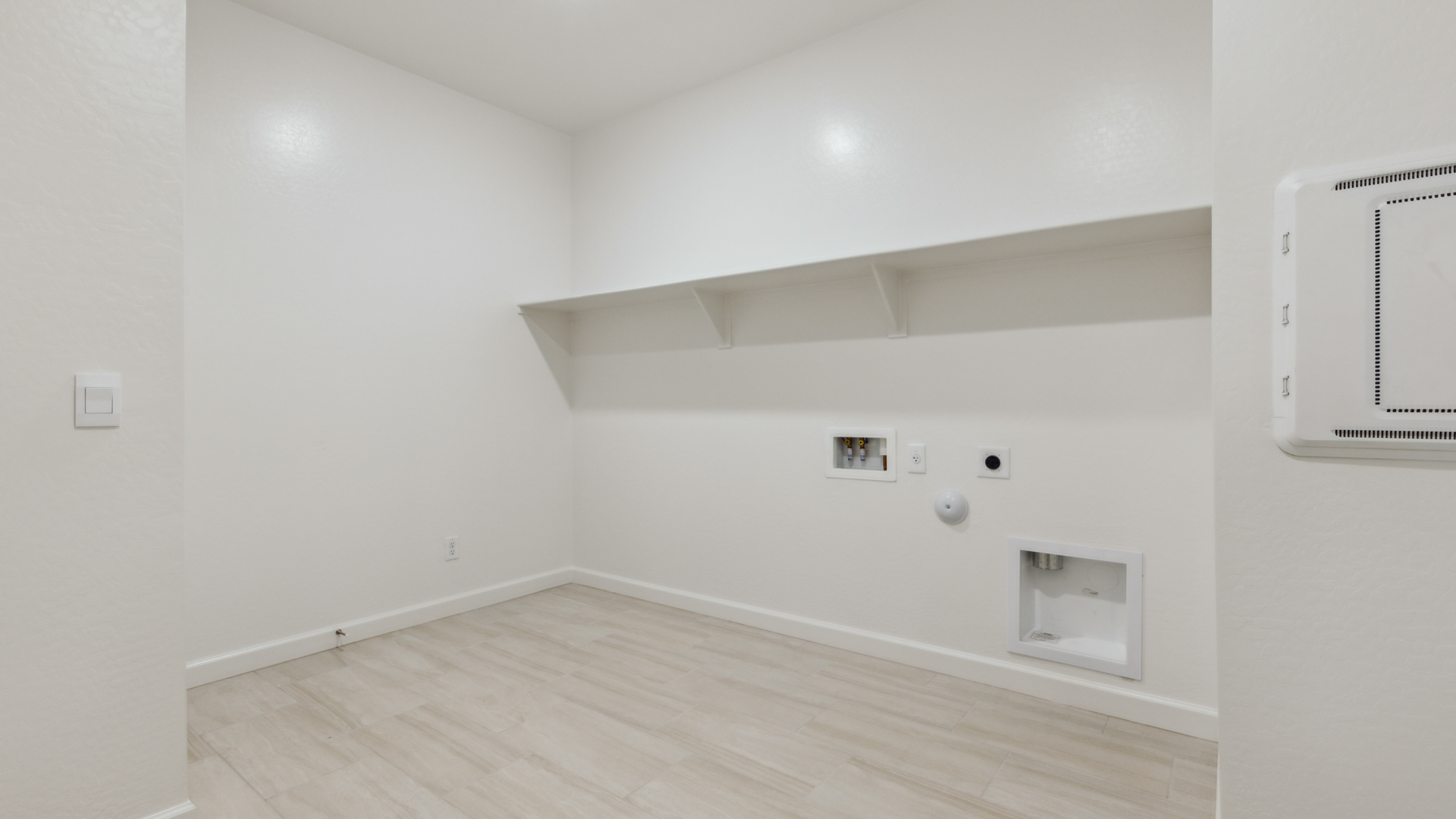 laundry room with shelving