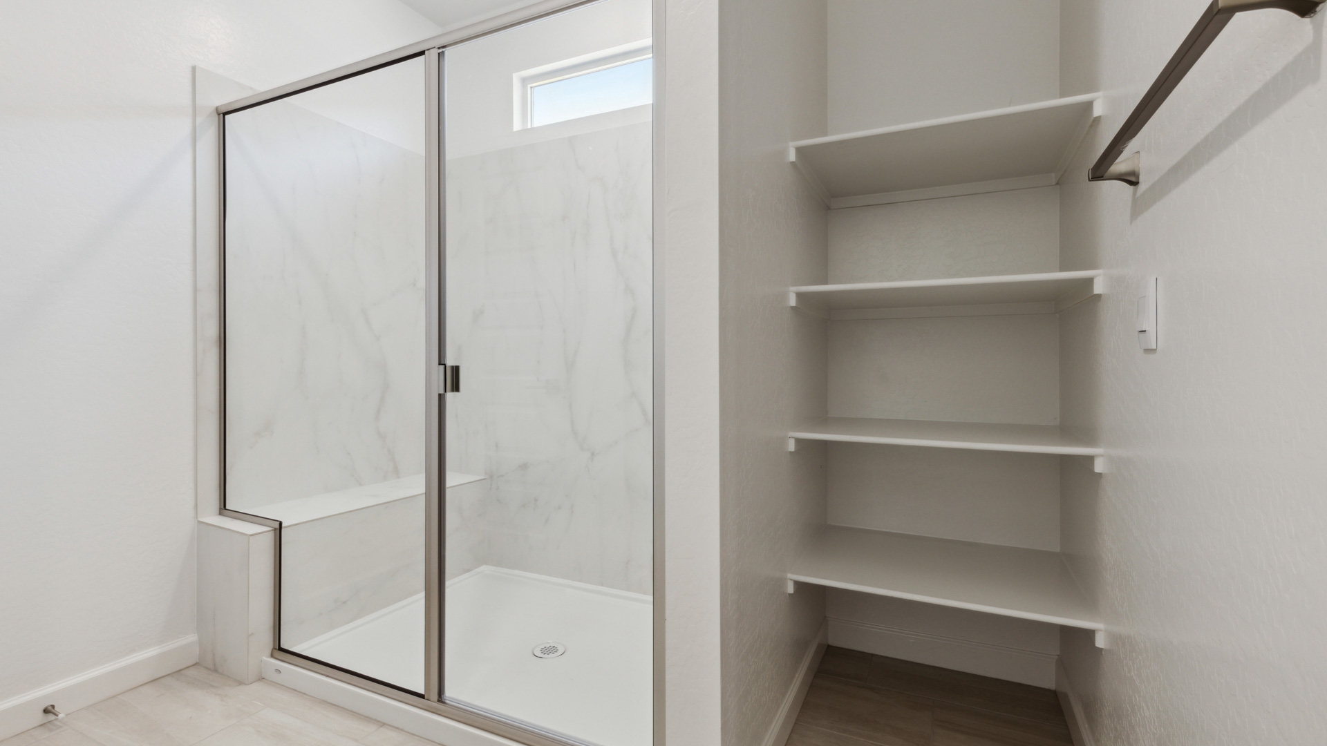 primary bathroom with dual vanities