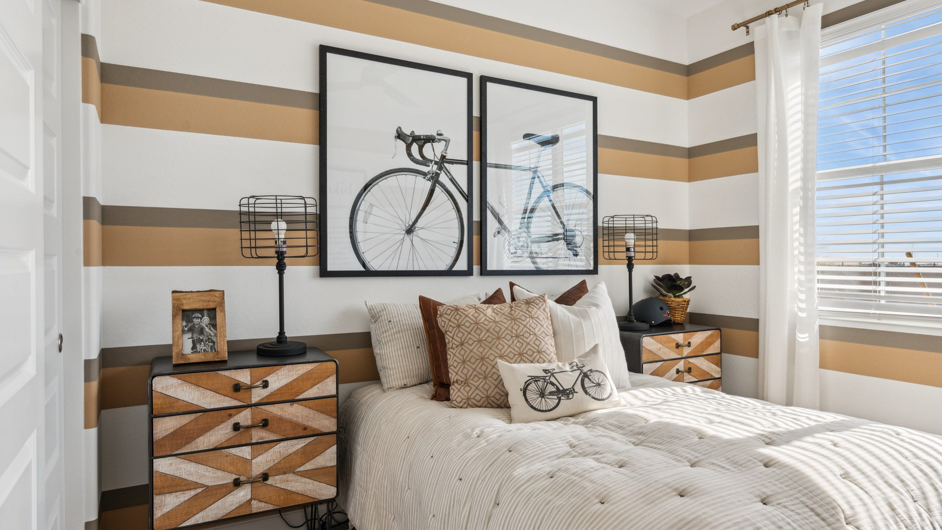 Comfortable guest bedroom featuring neutral-toned walls and a large closet.