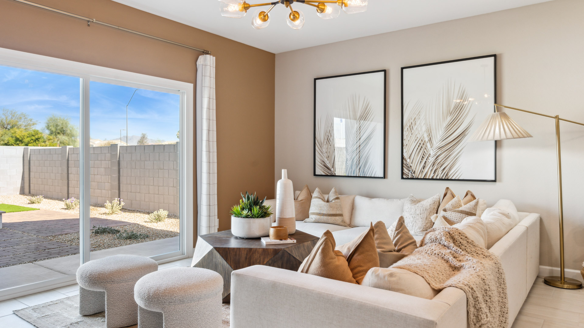 A cozy living room featuring a comfortable couch, a stylish coffee table, and an elegant painting on the wall.