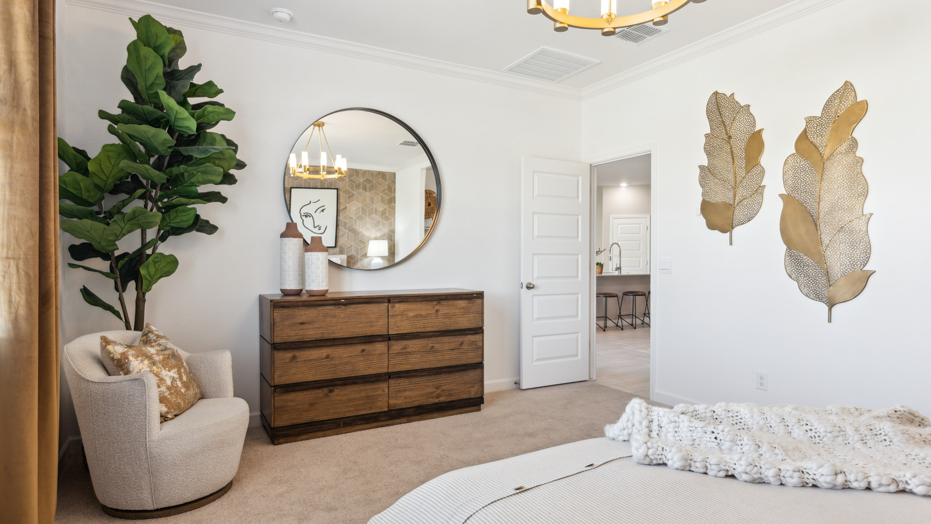 Primary bedroom with plush carpeting and a large walk-in closet.
