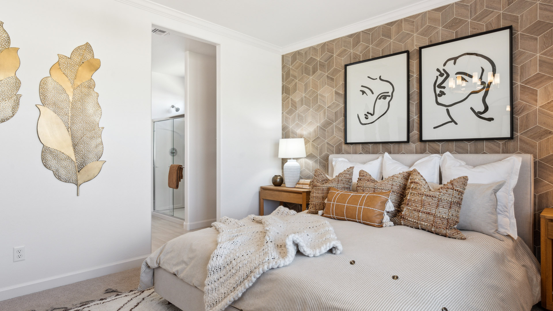Primary bedroom with plush carpeting and a large walk-in closet.