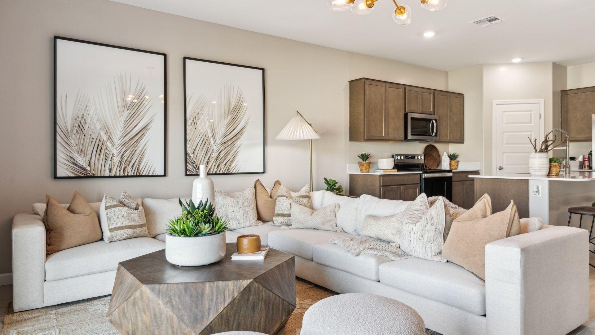 A cozy living room featuring a comfortable couch, a stylish coffee table, and an elegant painting on the wall.