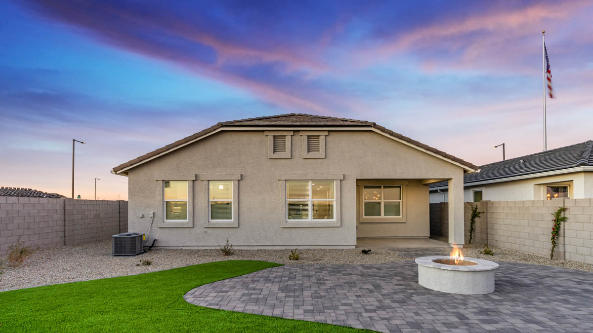 Large fenced-in backyard with a covered patio, perfect for outdoor entertainment.