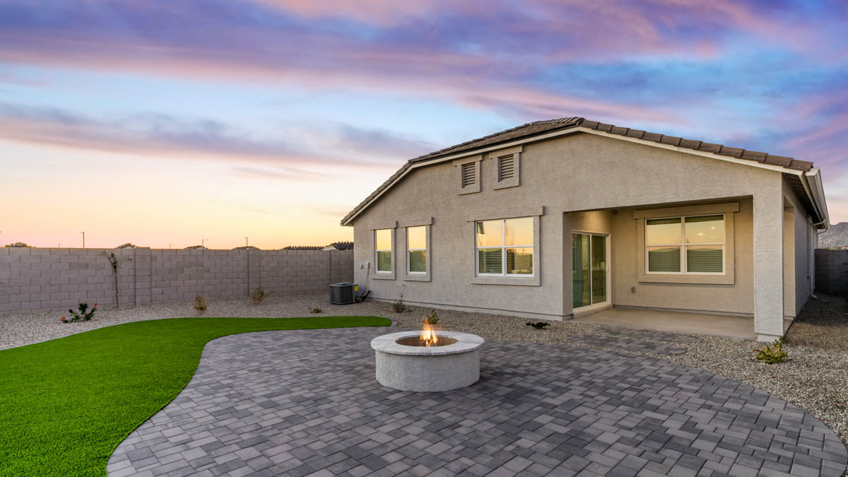 Large fenced-in backyard with a covered patio, perfect for outdoor entertainment.