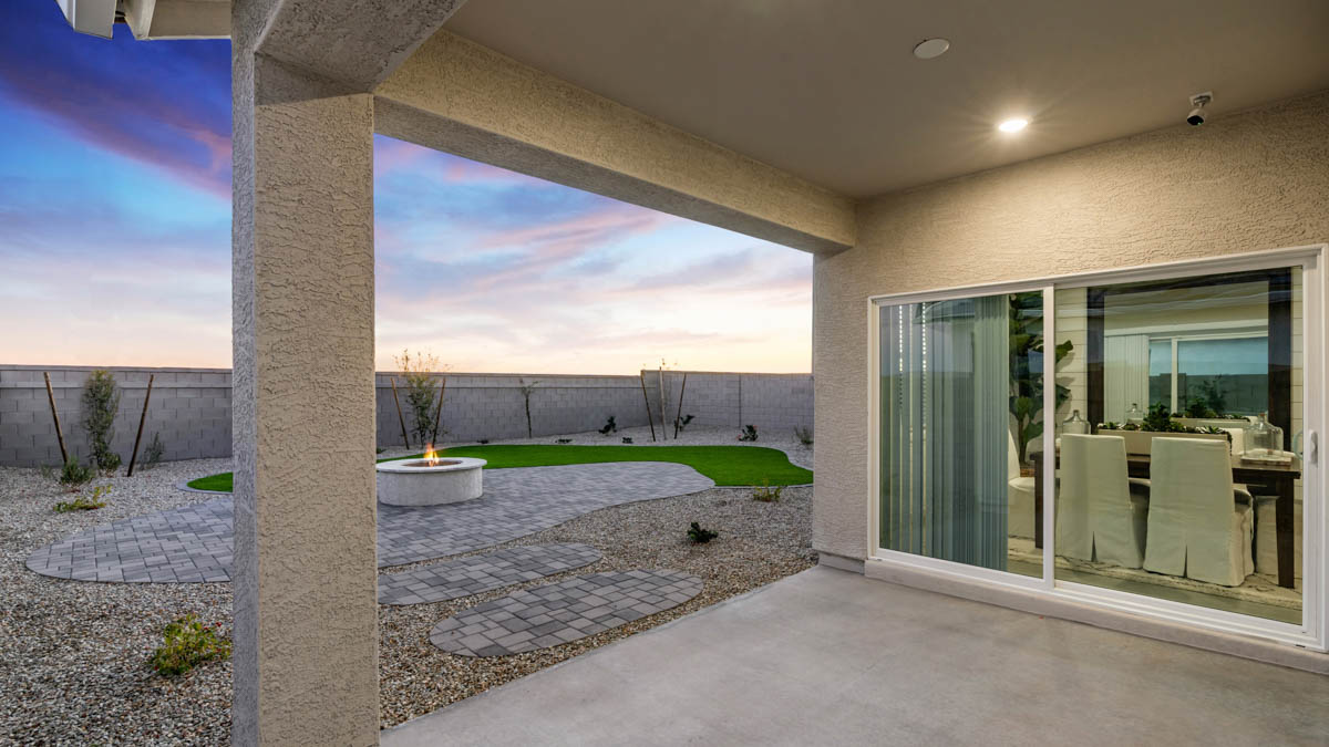 Large fenced-in backyard with a covered patio, perfect for outdoor entertainment.