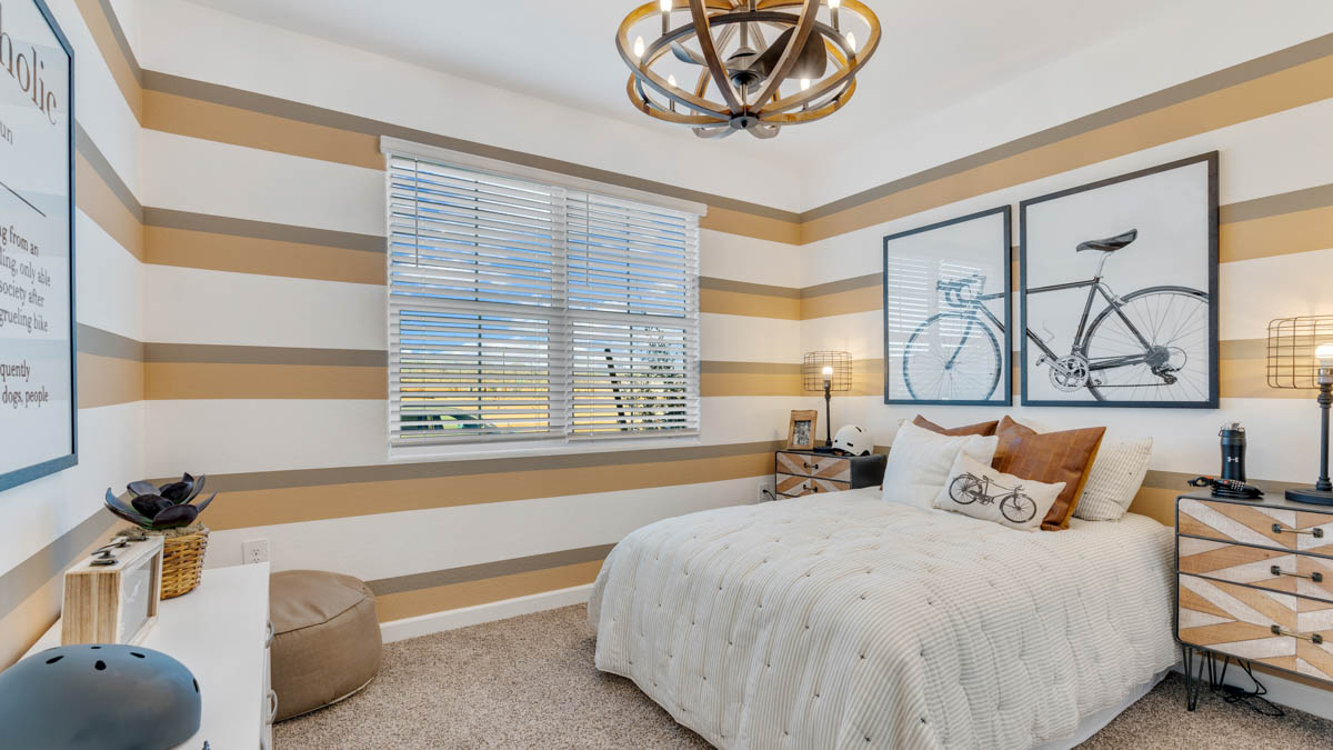 Comfortable guest bedroom featuring neutral-toned walls and a large closet.