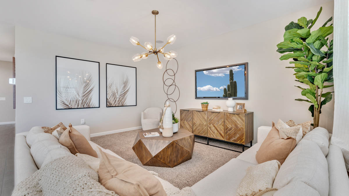 A well-organized living room that includes a kitchen and dining area, creating a warm and welcoming environment for gatherings.