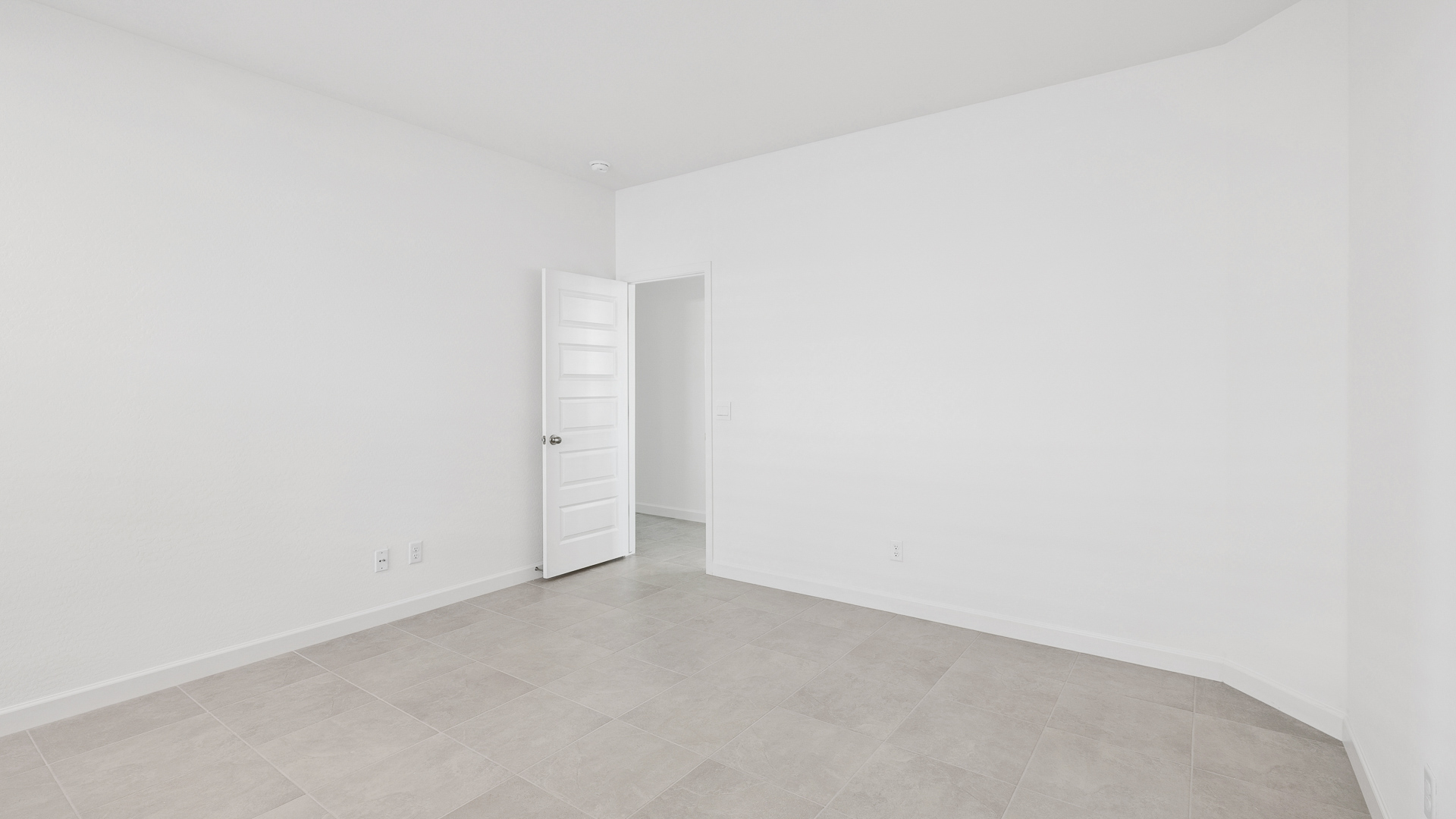 A well-organized living room that includes a kitchen and dining area, creating a warm and welcoming environment for gatherings.