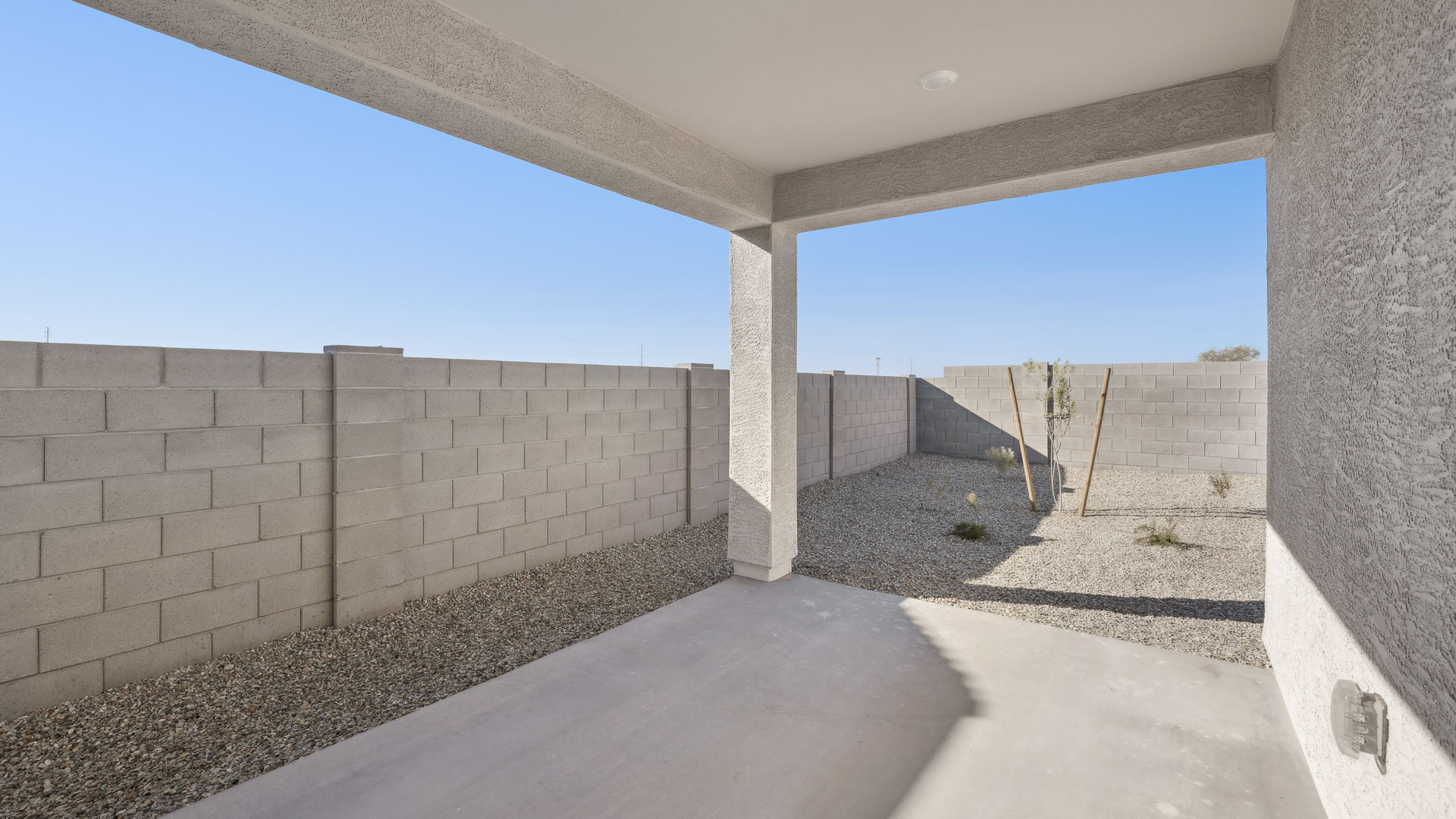 Large fenced-in backyard with a covered patio, perfect for outdoor entertaining.