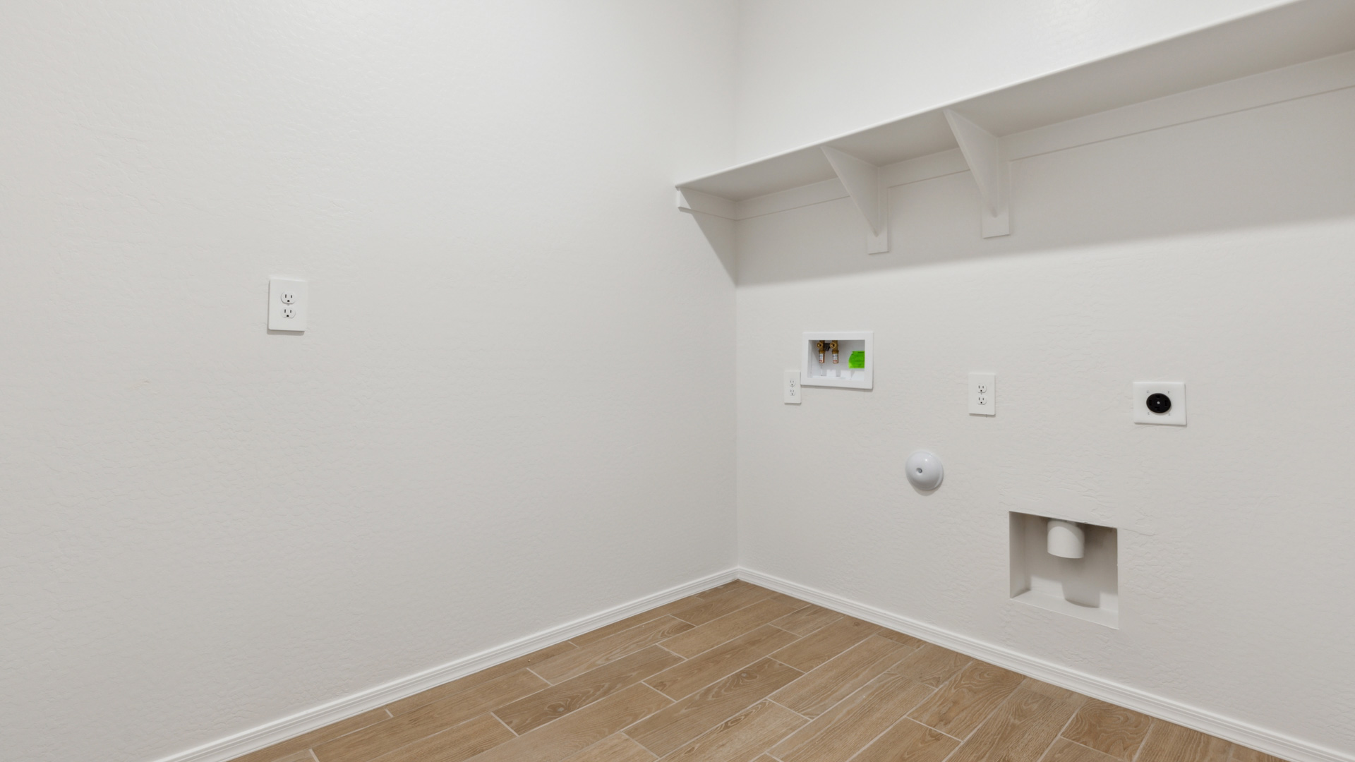 Laundry room with shelves.
