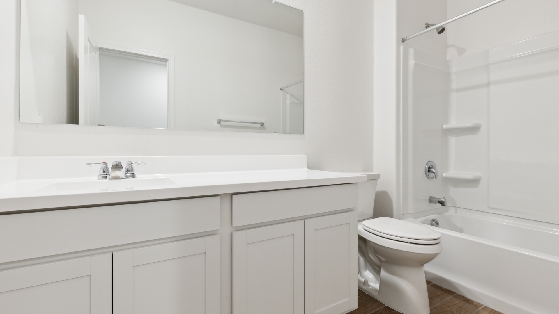 Guest bathroom with a sink, toilet, and shower.