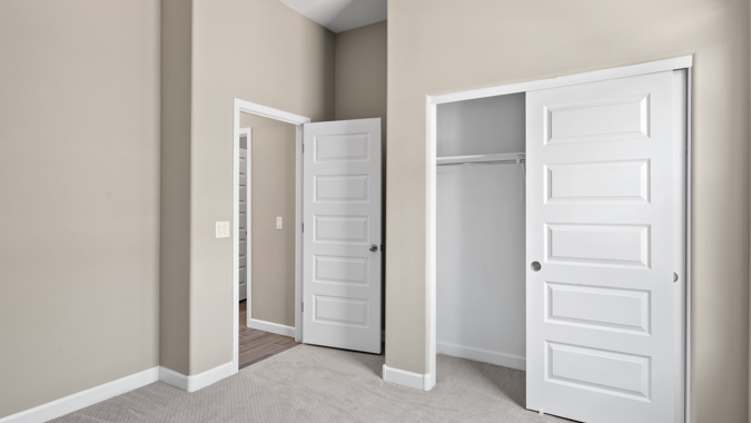 Kid's bedroom with large closet space.