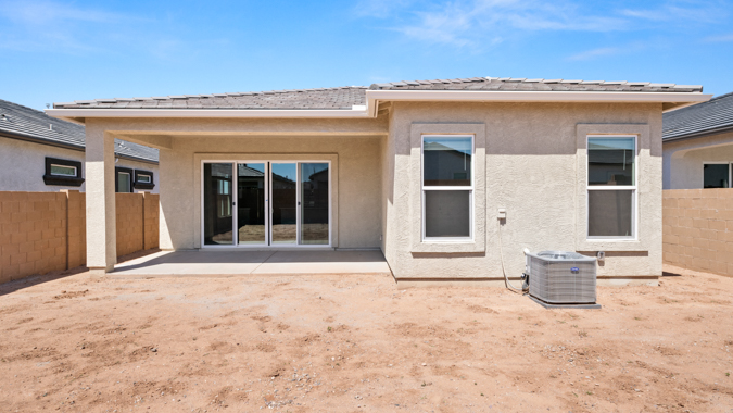 Large fenced-in backyard with a covered patio, perfect for outdoor entertaining.